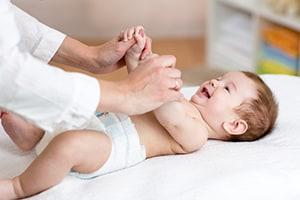 Doctor Checking Baby's Arm