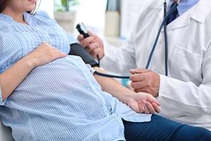 Doctor Treating Pregnant Woman